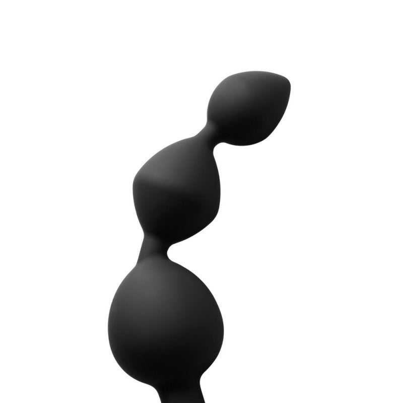 Plug anal Triball en silicone noir, souple et ergonomique.