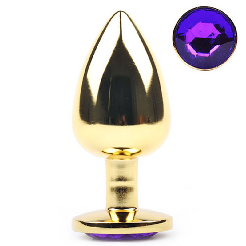 Plug anal en métal doré avec base décorée d’un diamant violet